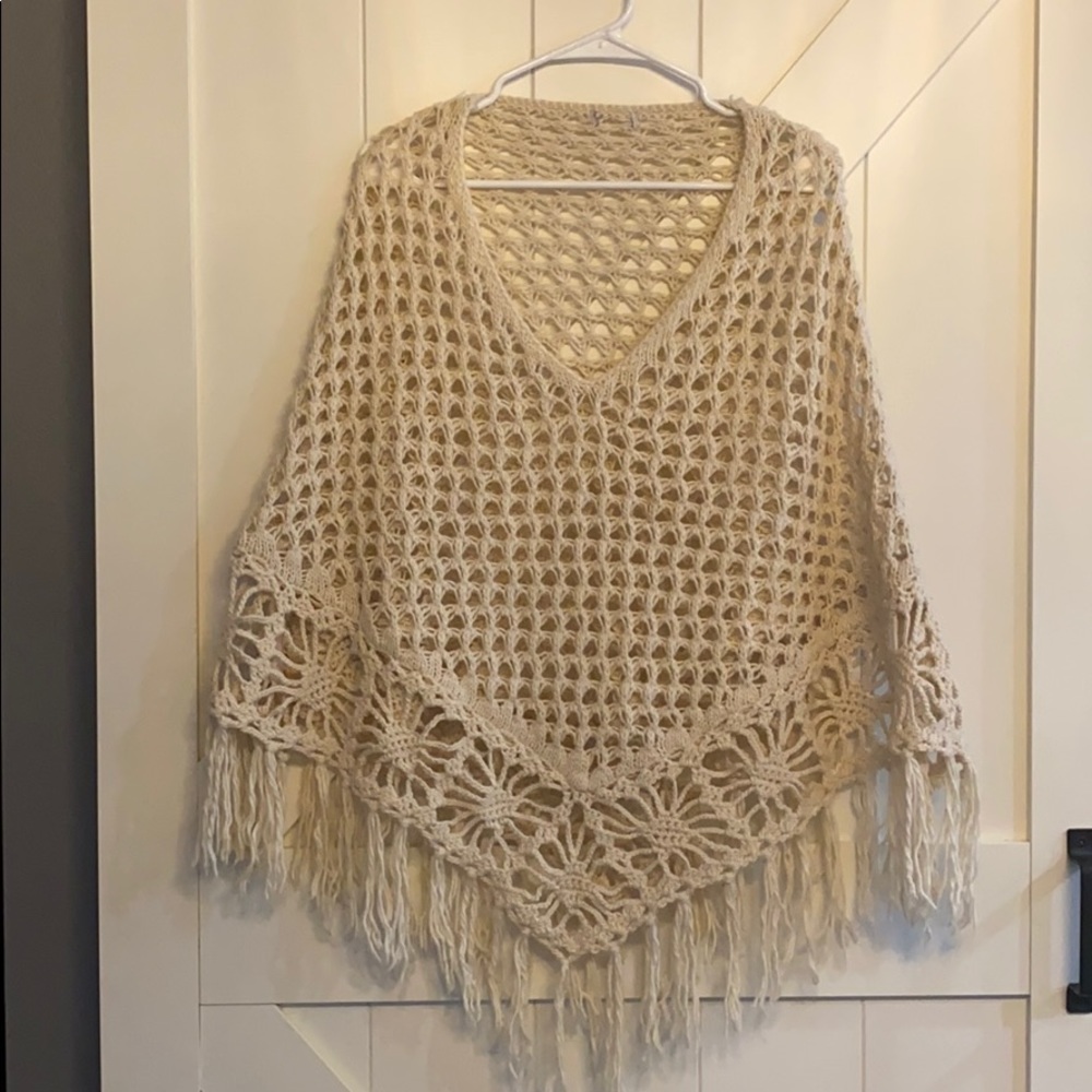 Crochet poncho with fringe